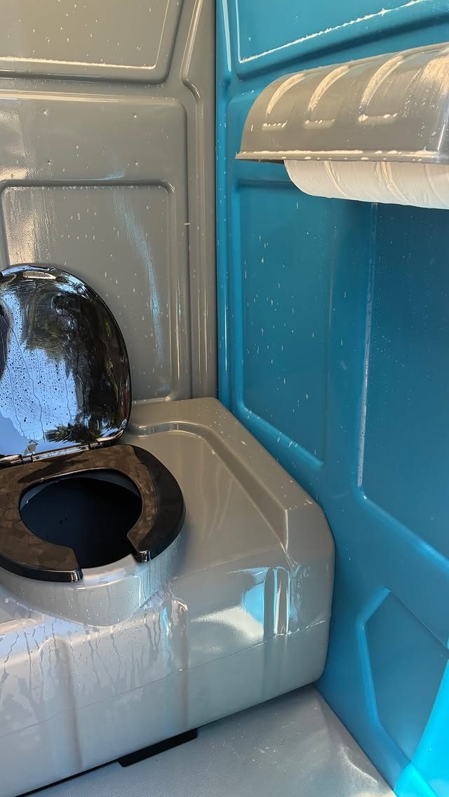 The clean, fully stocked interior of a Pro Portable Restrooms unit