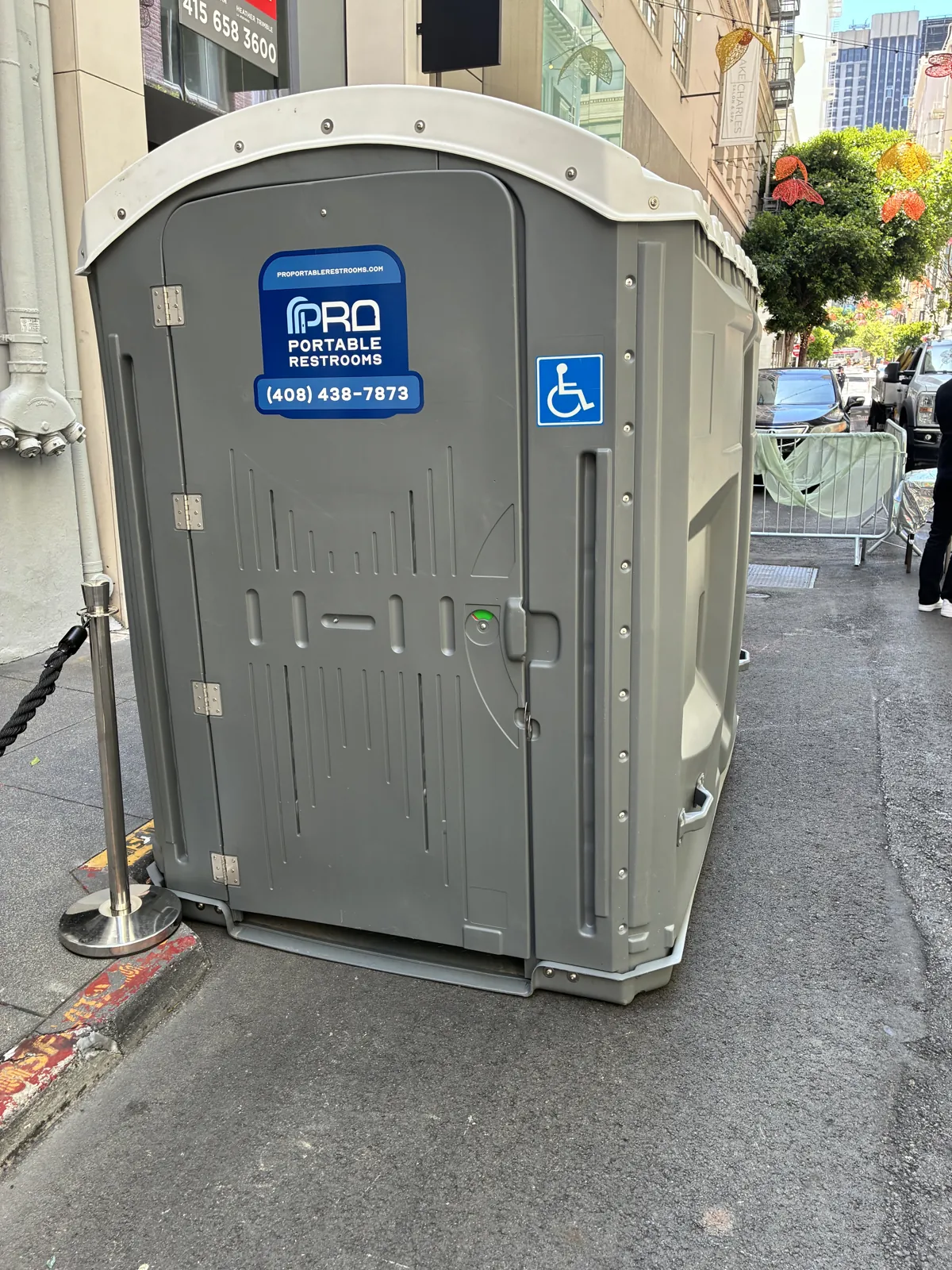 An ADA accessible Pro Portable Restrooms unit marked with a wheelchair access decal