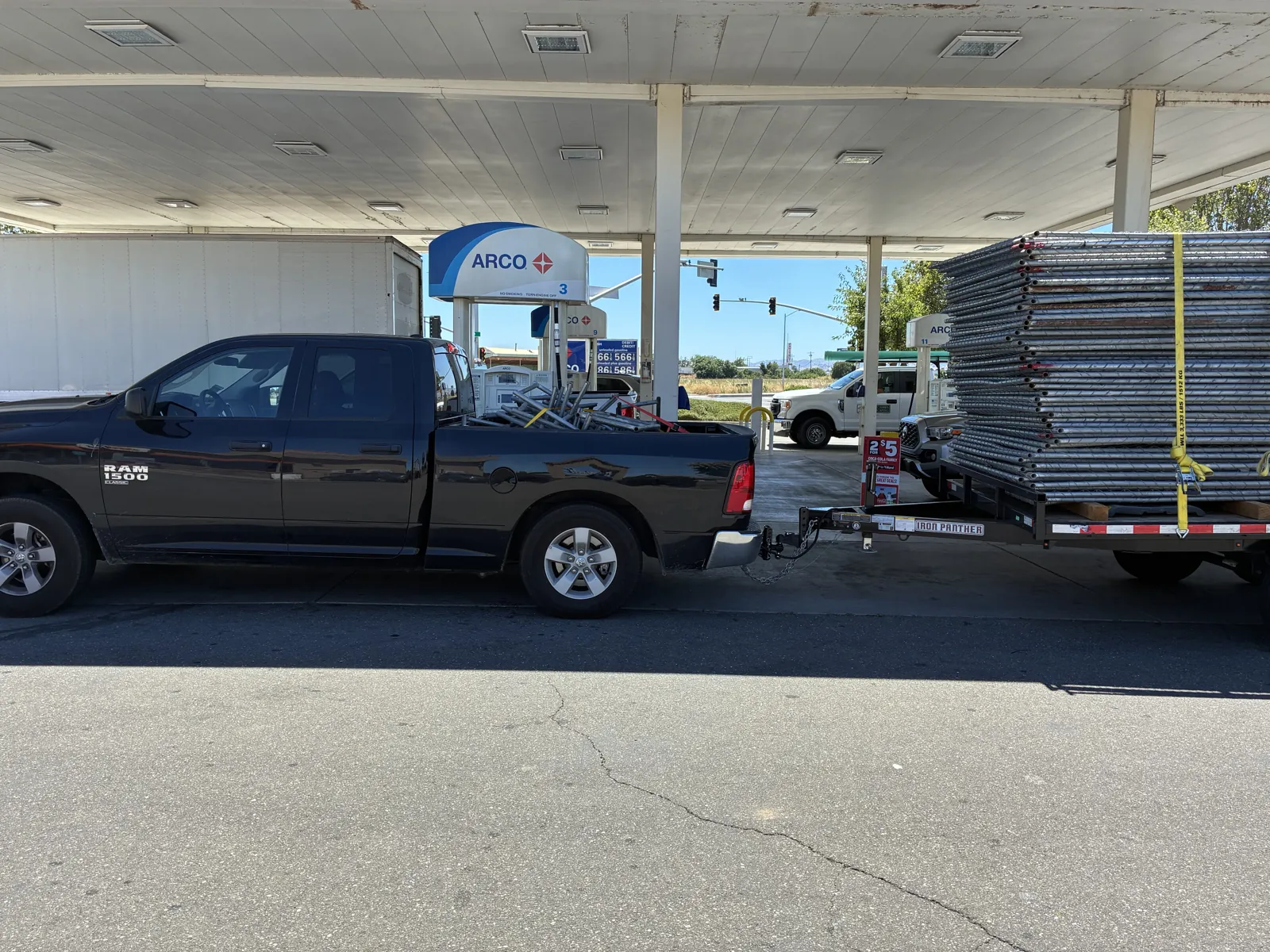 Temporary fencing installed around the perimeter of a commercial dealership