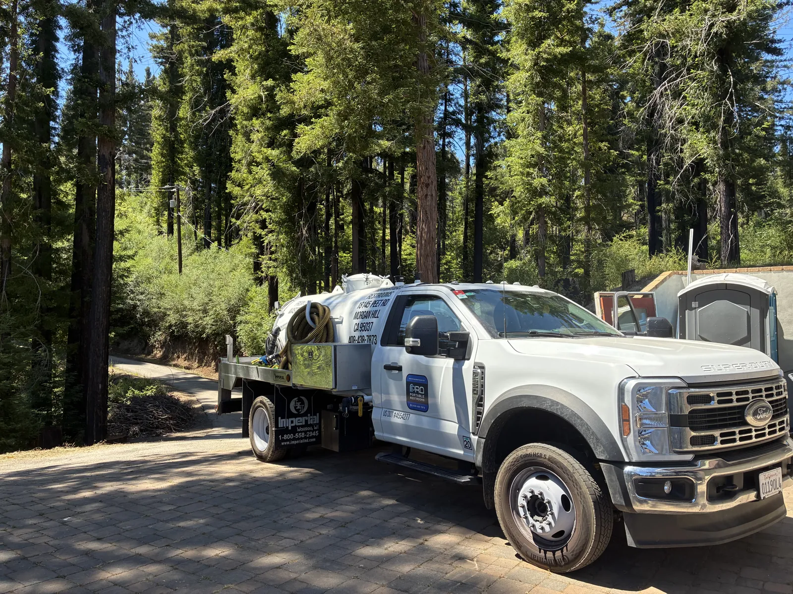 A Pro Portable Restrooms service truck on a job in the redwoods