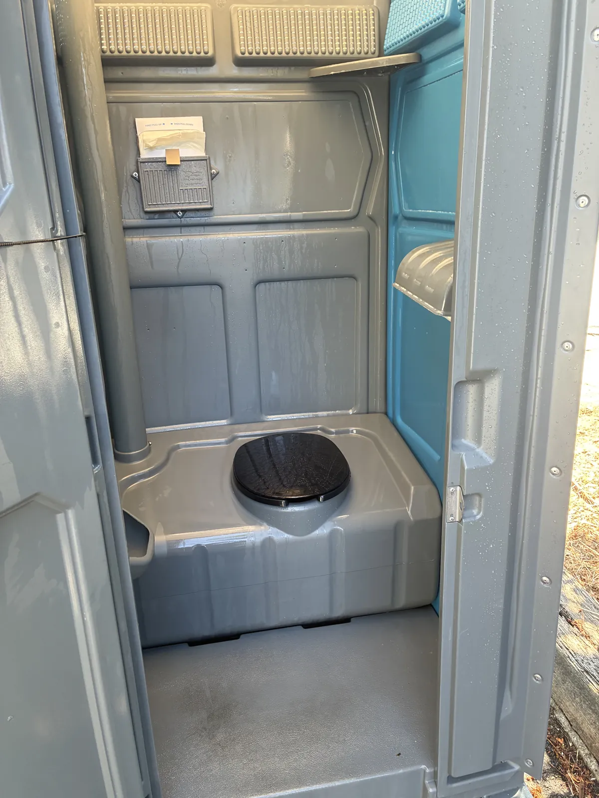 A clean and deodorized Pro Portable Restrooms unit interior ready for use
