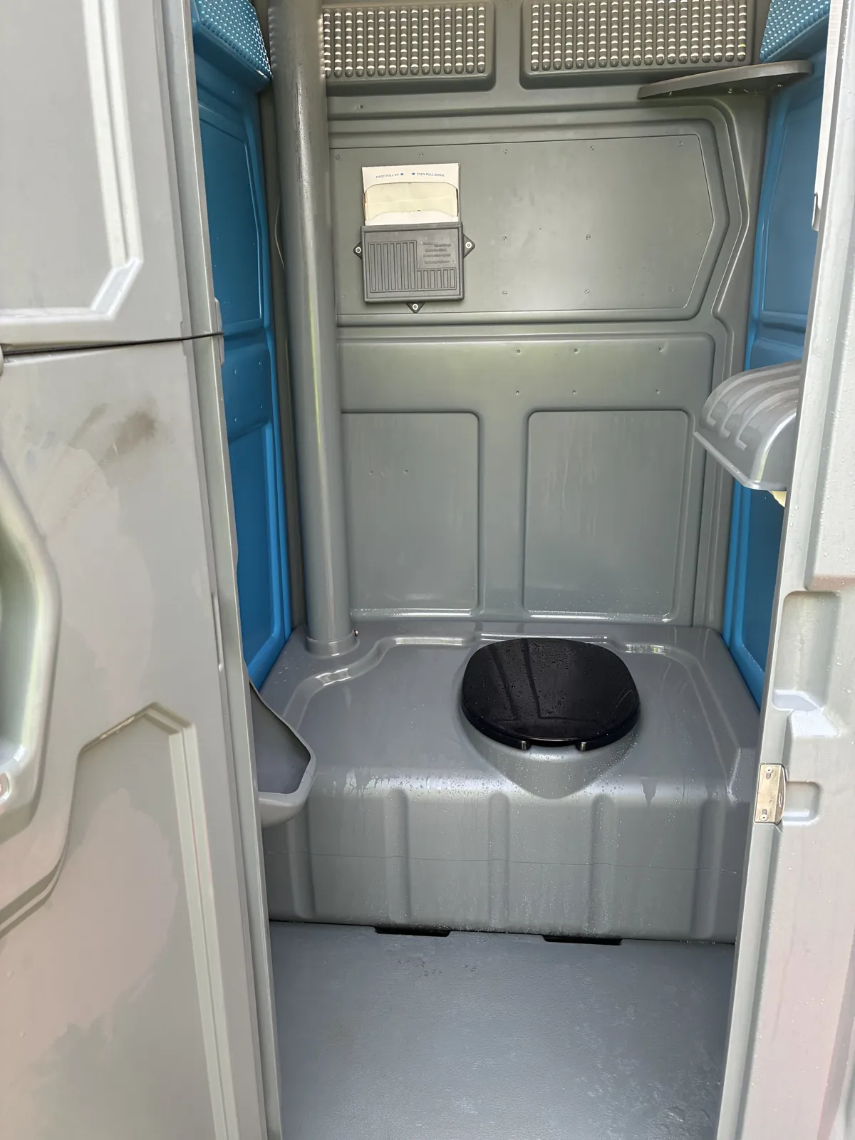 The spotless, fully stocked interior of a Pro Portable Restrooms unit