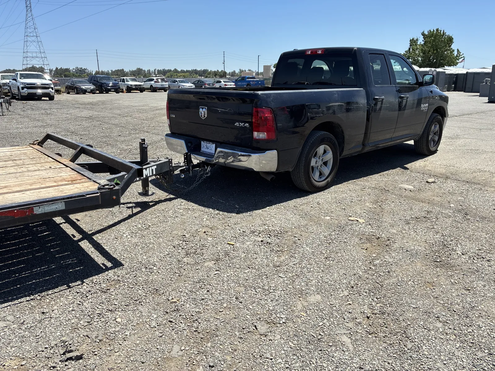 A Pro Portable Restrooms Ram truck and flatbed staged in the lot