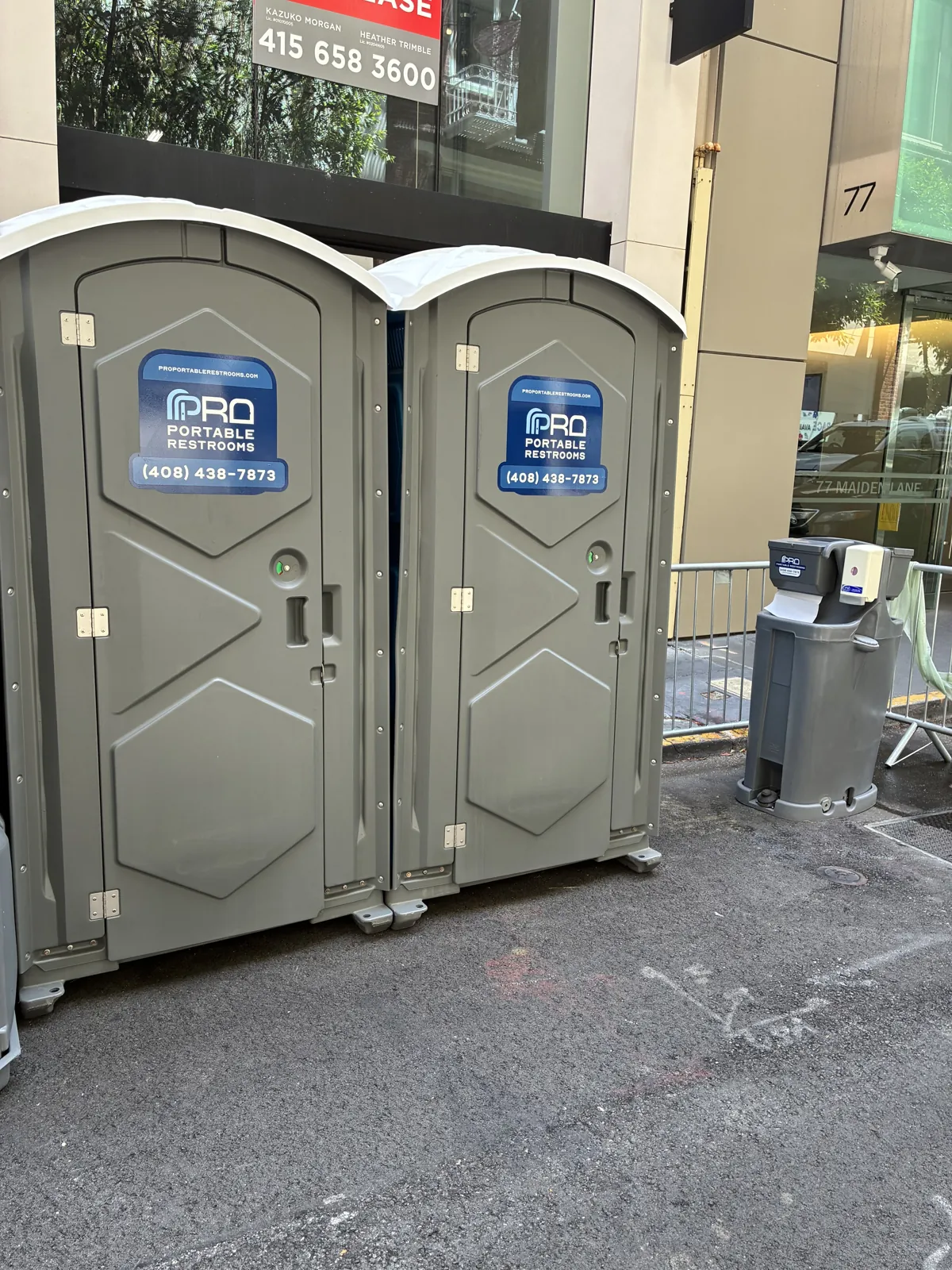 Clean Pro Portable Restrooms units placed outside a commercial storefront