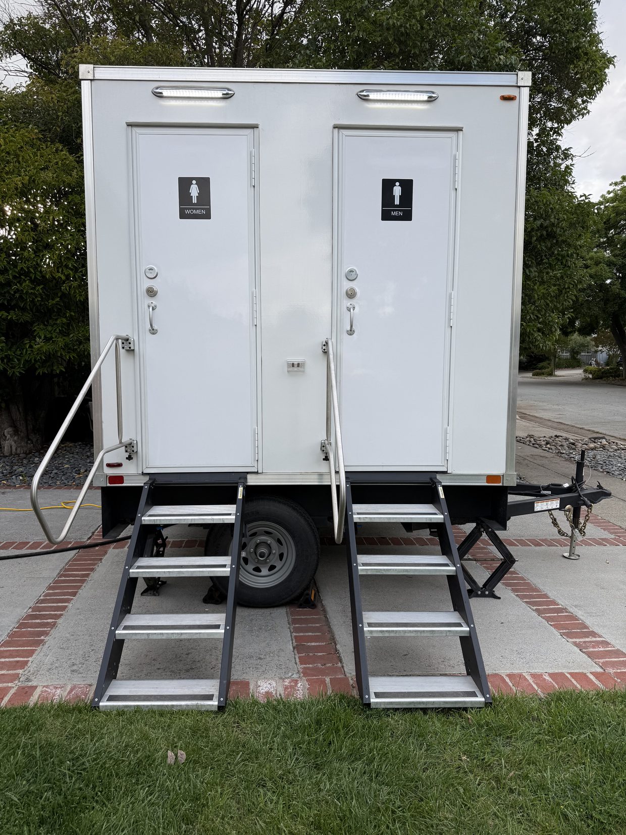 A three-station luxury restroom trailer with separate entrances for large events