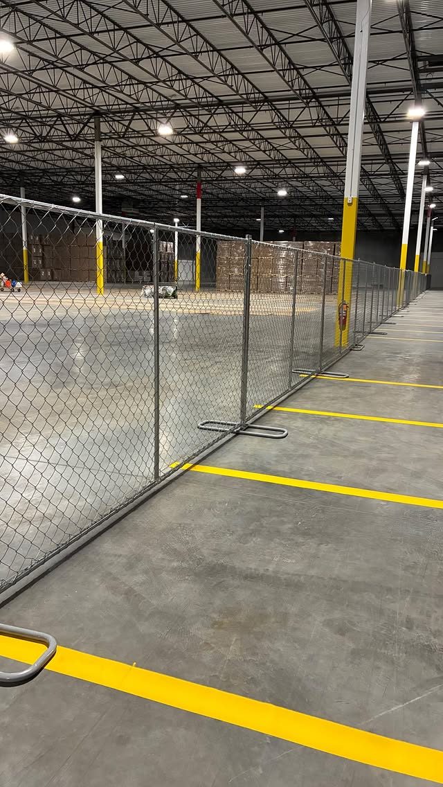 Temporary fencing securing an indoor storage area