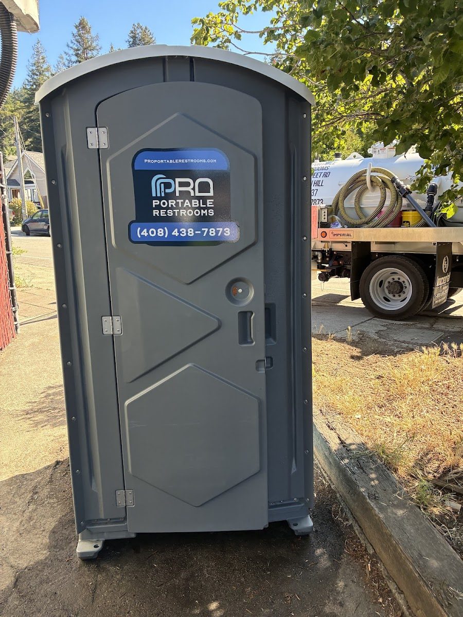 A Pro Portable Restrooms branded portable restroom on location